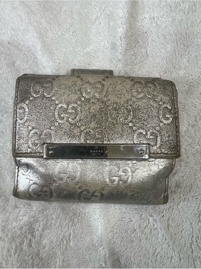 Authentic Vintage Gucci Metallic Silver GG Embossed Leather Wallet.